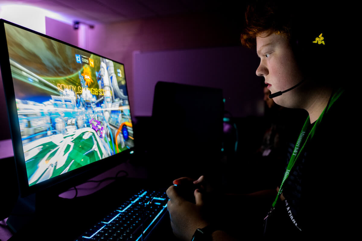 a student plays in an esports competition